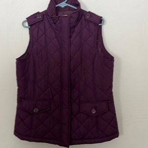 Izod purple vest. Size large. 2 pockets. Decorative buttons. Zipped vest.